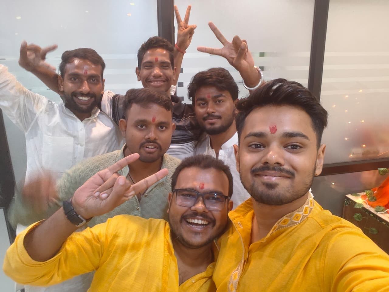 TradeAura team cheering together in a Ganesh Chaturthi group selfie