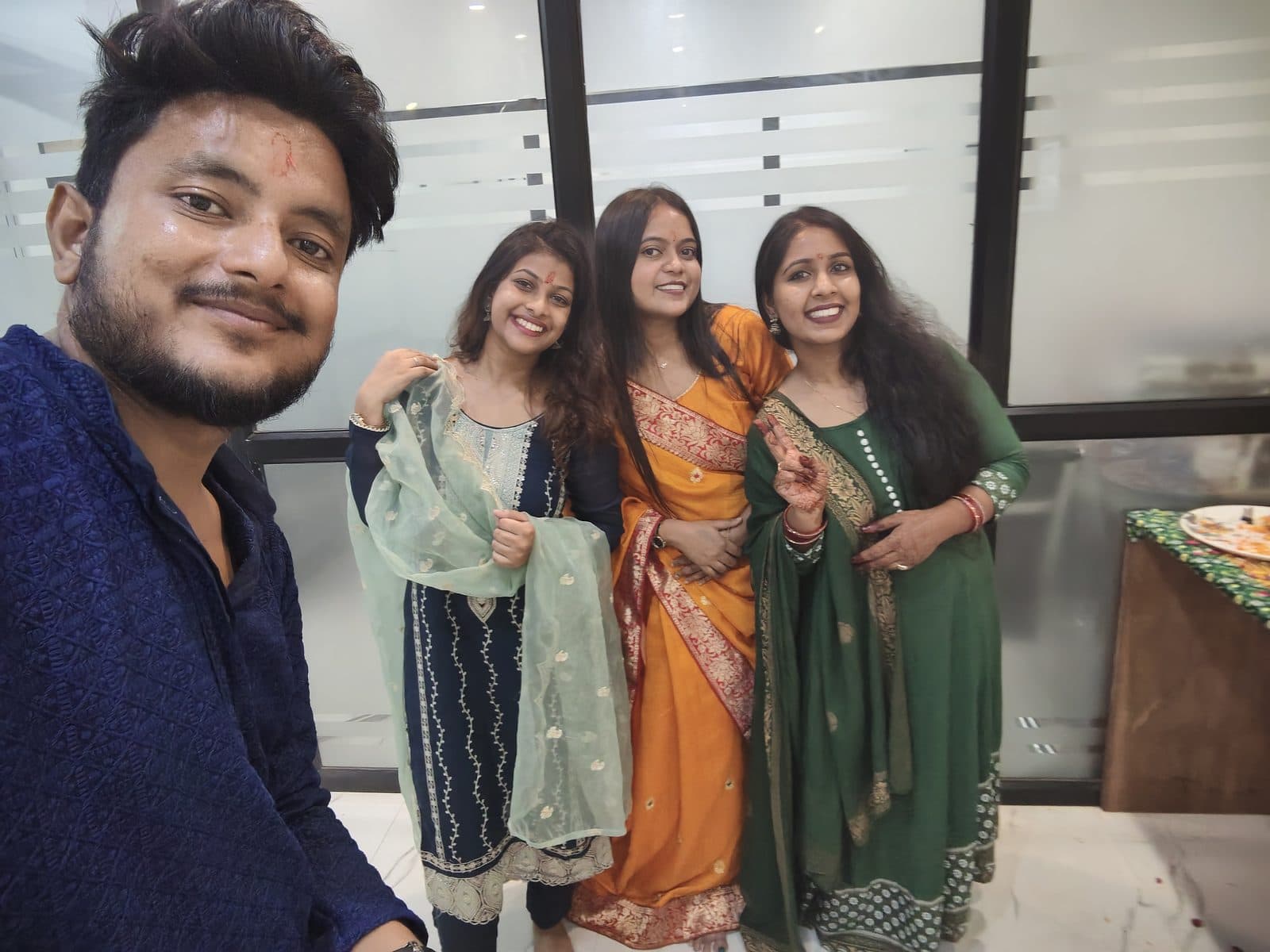 TradeAura team members in traditional outfits posing together on Ganesh Chaturthi