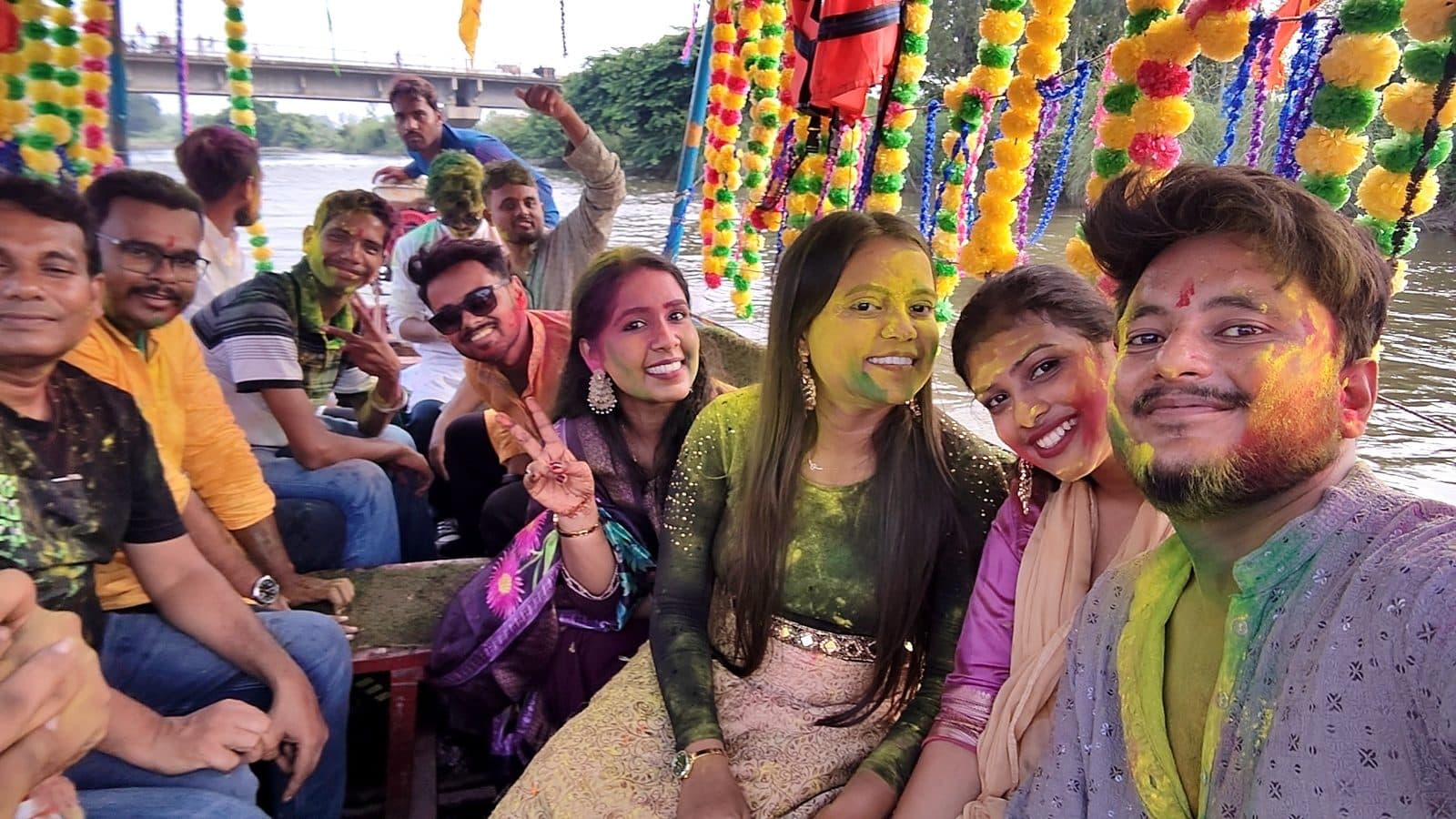 TradeAura team on a festive boat during the Ganesh visarjan procession