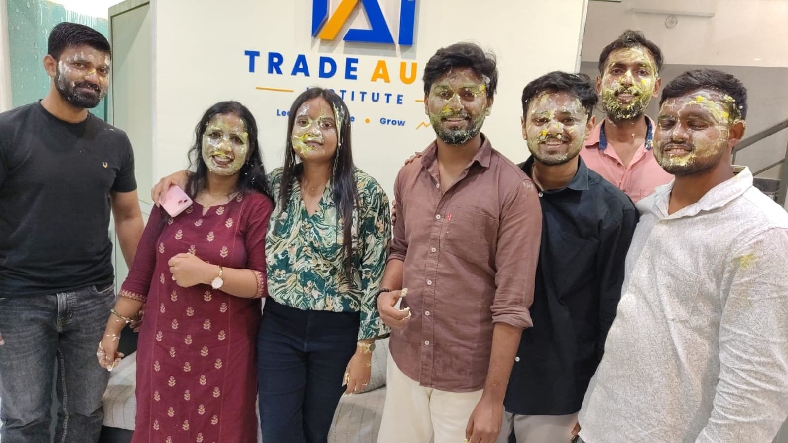 Birthday celebration moment with the TradeAura team gathered together