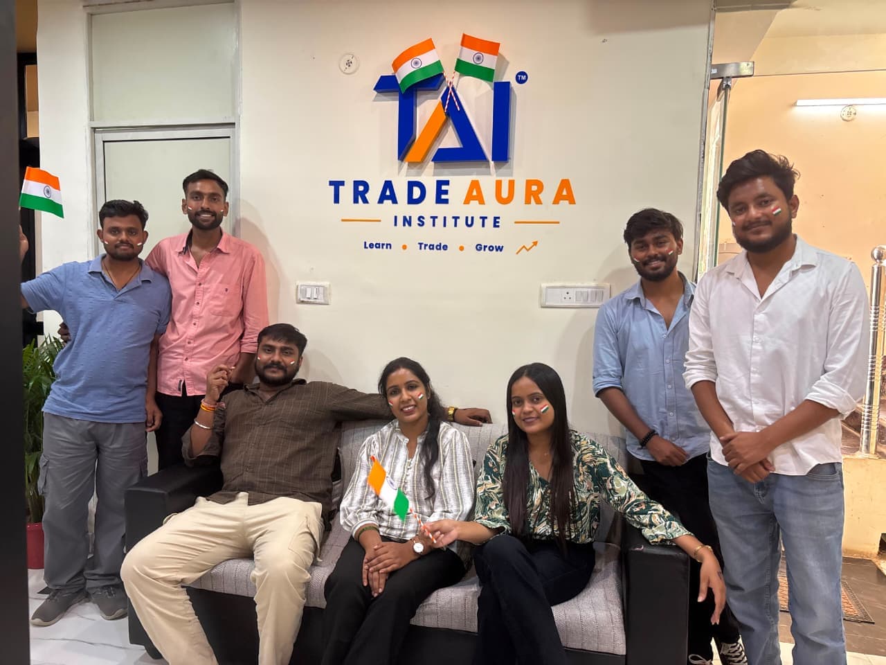 Mentors and students at TradeAura sharing sweets and celebrating Independence Day together