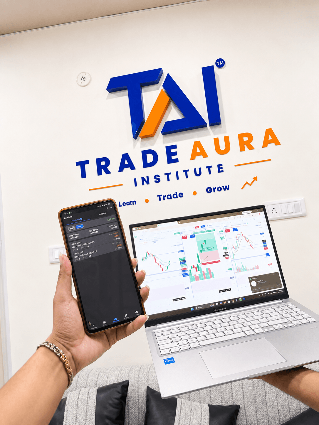 TradeAura students tracking live market movements on screen during a trading session