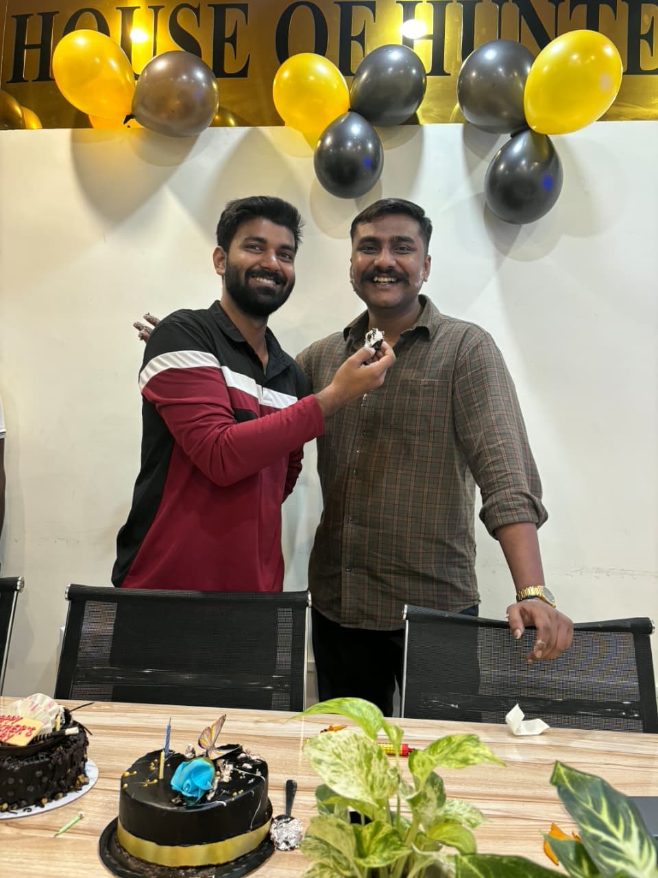 Students and mentors celebrating Teacher's Day with cake at TradeAura Institute
